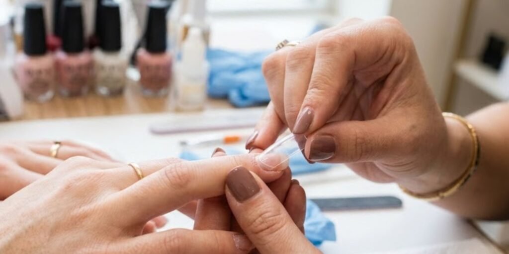 applying nail tips before acrylic application
